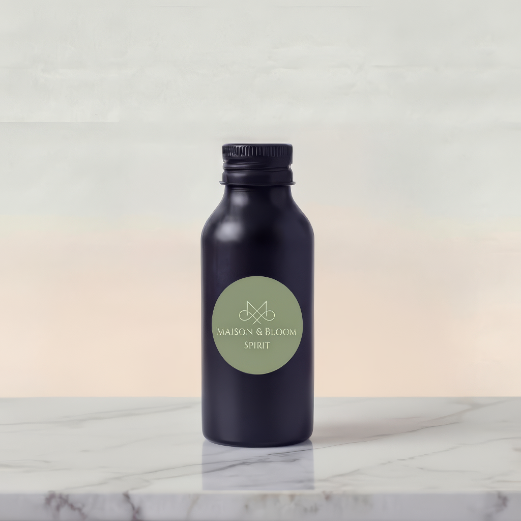 Matte black bottle with green label reading 'MAISON & BLOOM SPIRIT' on marble surface