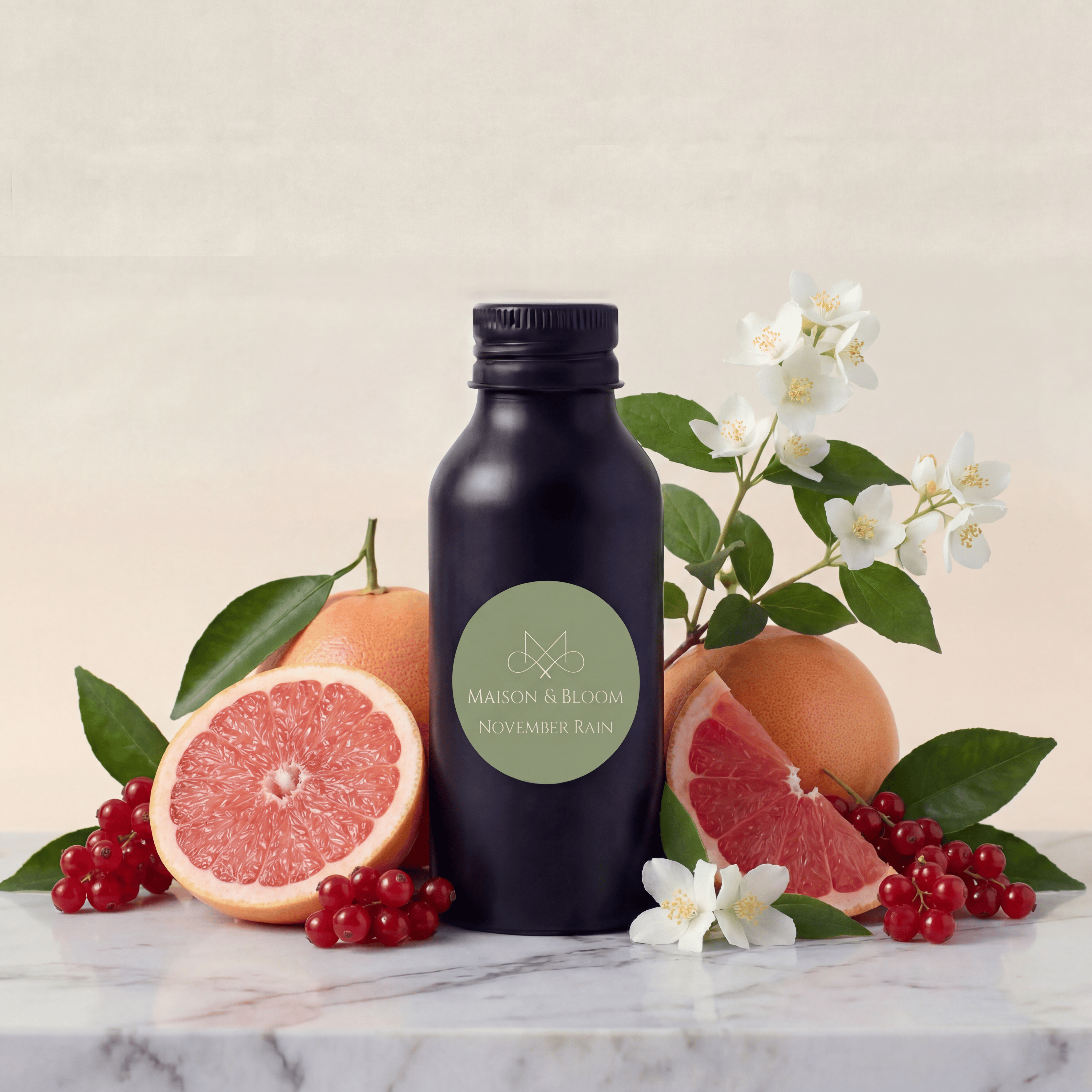 Black bottle labeled November Rain with grapefruit, currants, and white flowers on marble surface