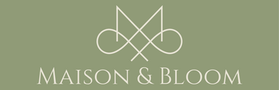 Minimalist beige Maison & Bloom logo on sage green background with elegant botanical motif