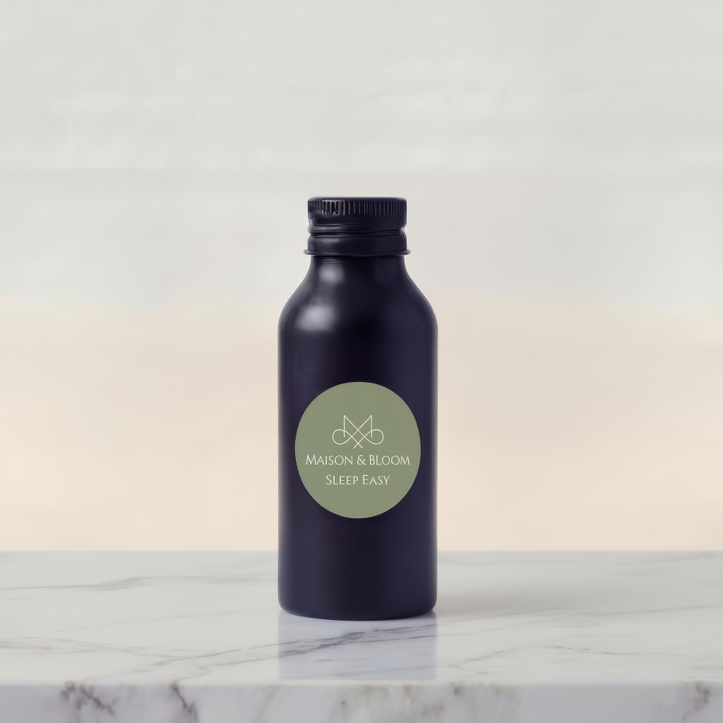 Black Sleep Easy bottle with green label on marble surface, minimalist background