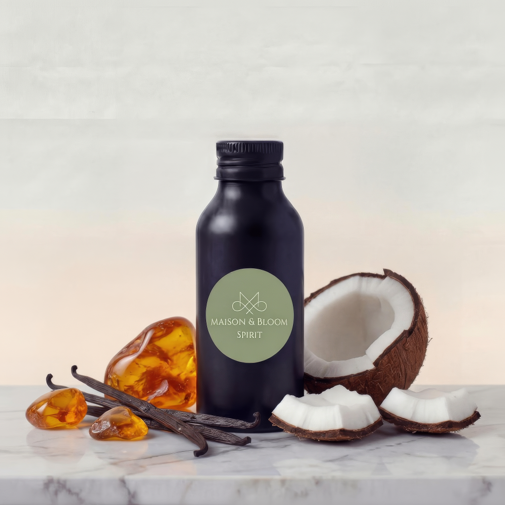 Black bottle labeled 'Spirit' with coconut, amber stones, and vanilla beans on marble surface
